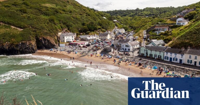 ‘Dizzying coastal paths, quiet beaches and dolphins’: readers’ highlights of the UK coastline | United Kingdom holidays