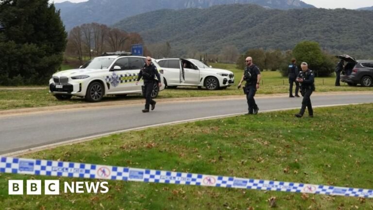 Manhunt after two police officers shot dead